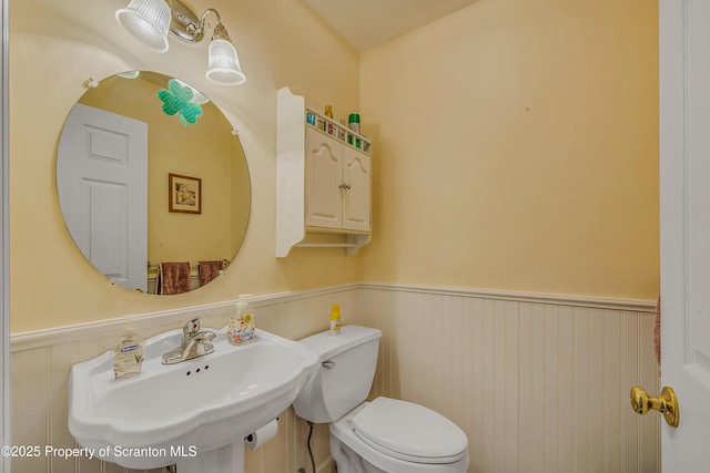 8 Parkland Dr Bldg 9, South Abington Twp, PA 18411 - bathroom with wainscoting and toilet
