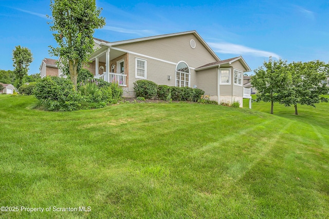 8 Parkland Dr Bldg 9, South Abington Twp, PA 18411 - view of side of property featuring a yard and covered porch