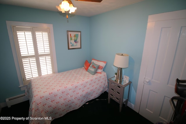 938 Oak St, Scranton, PA 18508 - bedroom with baseboard heating, multiple windows, and a ceiling fan