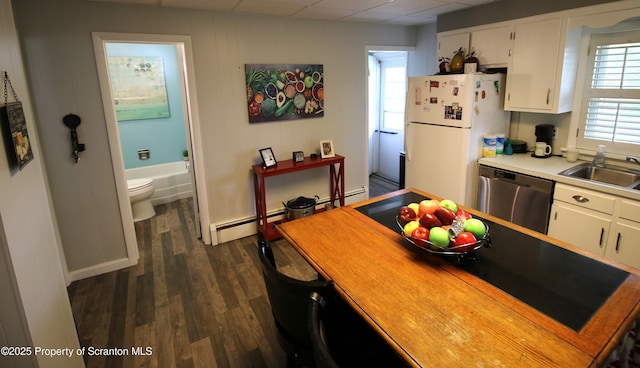 938 Oak St, Scranton, PA 18508 - kitchen featuring stainless steel dishwasher, freestanding refrigerator, dark wood finished floors, white cabinets, and a drop ceiling