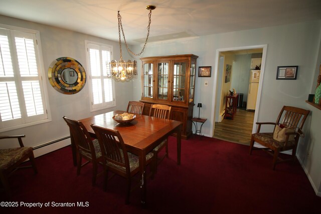 938 Oak St, Scranton, PA 18508 - dining space with a baseboard radiator and a chandelier