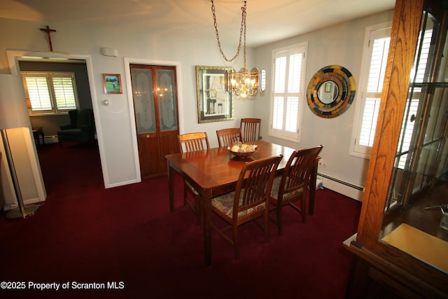 938 Oak St, Scranton, PA 18508 - dining area with a baseboard heating unit, plenty of natural light, dark colored carpet, and a chandelier