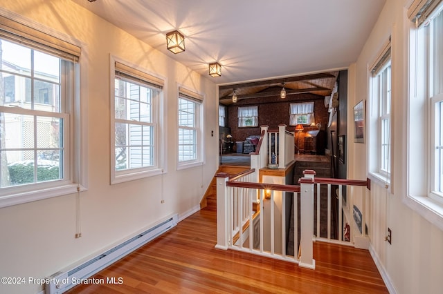 interior space featuring a baseboard heating unit