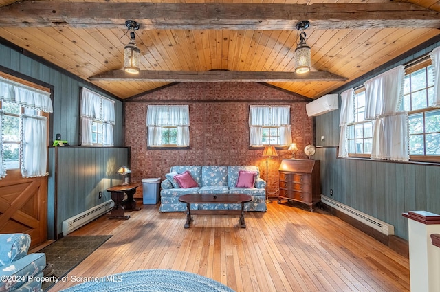 living area with lofted ceiling with beams, an AC wall unit, a baseboard heating unit, and hardwood / wood-style floors