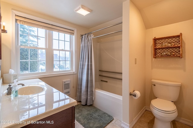 full bathroom featuring tile patterned floors, toilet, shower / tub combo with curtain, heating unit, and vanity