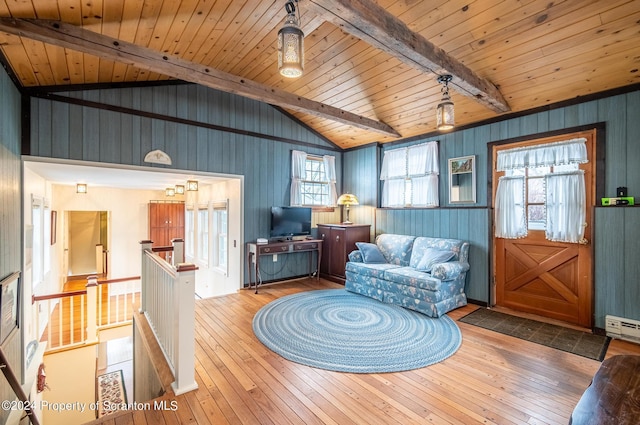 living area featuring wooden ceiling, an upstairs landing, wood-type flooring, and vaulted ceiling with beams