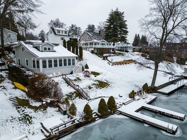 snowy aerial view featuring a residential view