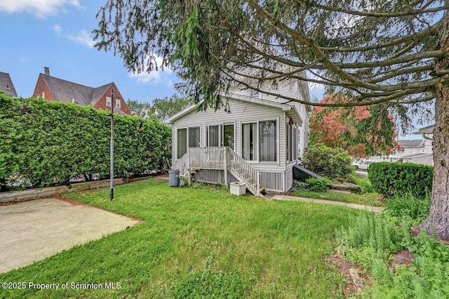 405 Dudley St, Dunmore, PA 18512 - rear view of house featuring a yard