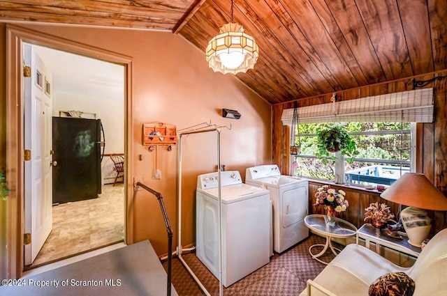 clothes washing area with wood ceiling and washing machine and clothes dryer