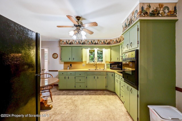 kitchen with sink, ceiling fan, green cabinets, and black appliances