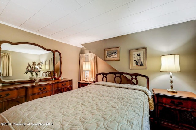 bedroom featuring ornamental molding