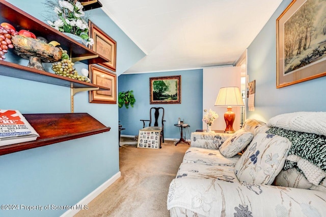 living room featuring light colored carpet and ornamental molding