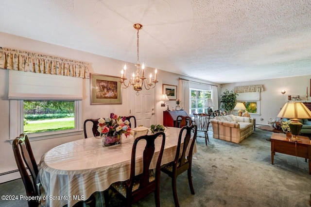 dining room with a chandelier, a textured ceiling, and carpet floors