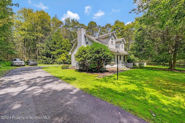 view of home's exterior featuring a lawn