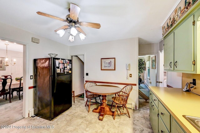 dining room with ceiling fan with notable chandelier and sink