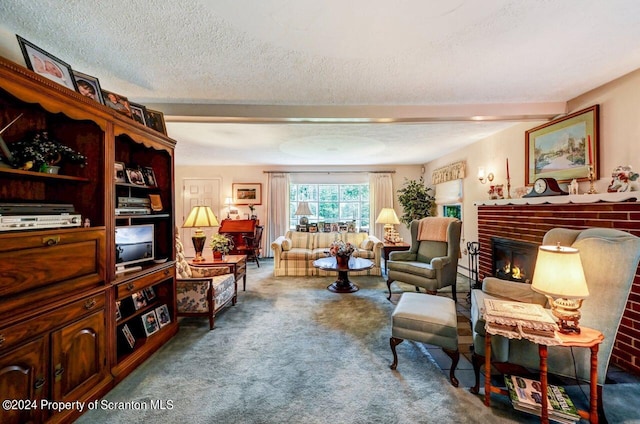 sitting room with a fireplace, a textured ceiling, carpet floors, and beam ceiling