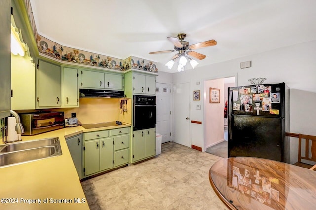 kitchen featuring black appliances, ceiling fan, green cabinets, and sink