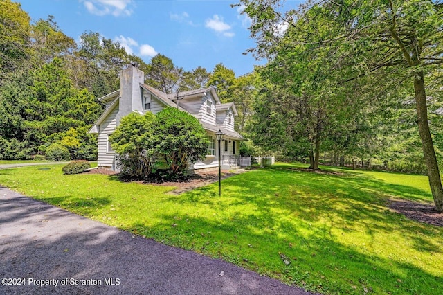 view of home's exterior with a yard