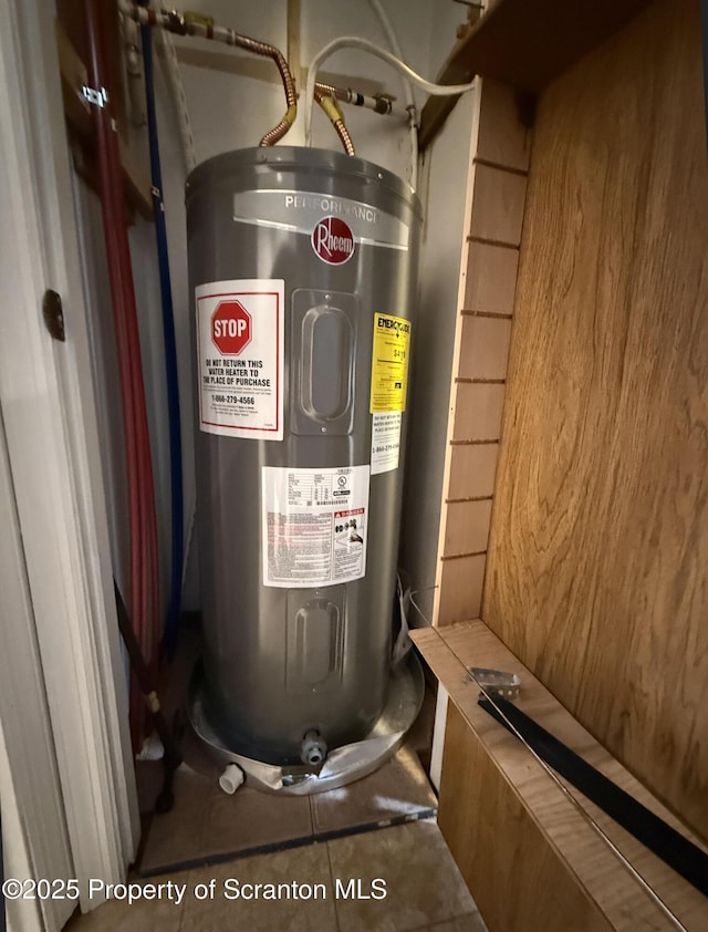 utility room featuring electric water heater