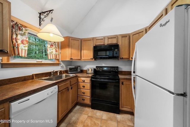 kitchen featuring dark countertops, lofted ceiling, brown cabinets, black appliances, and a sink