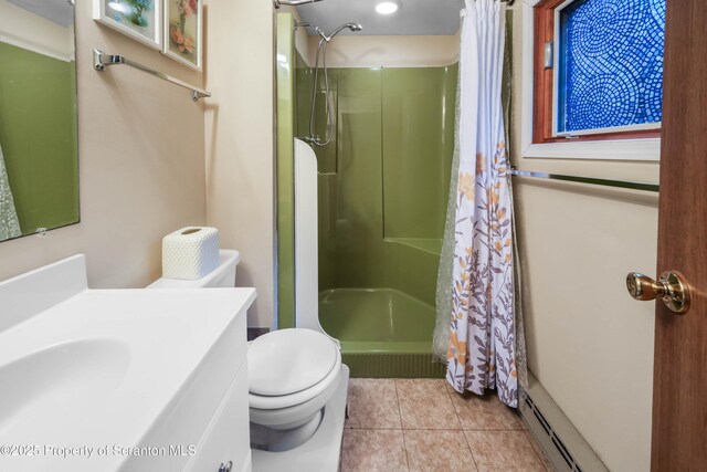 bathroom featuring vanity, a stall shower, tile patterned flooring, and toilet