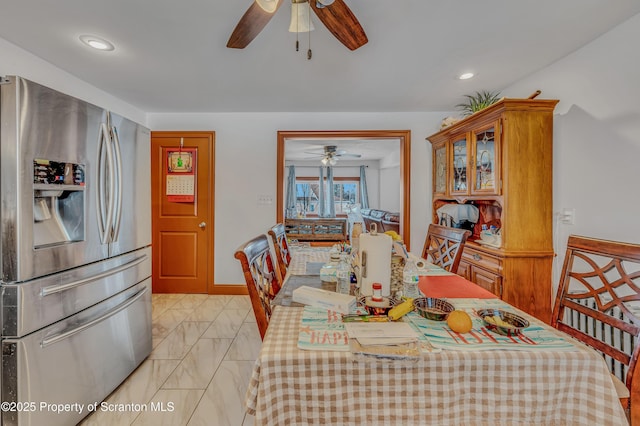 dining room featuring ceiling fan