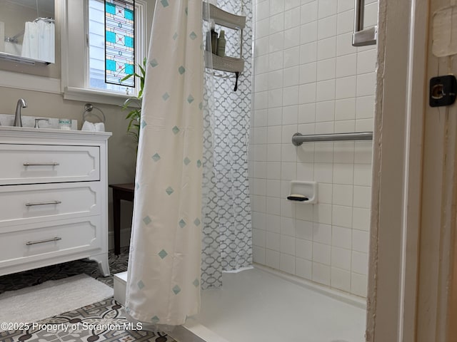 full bathroom featuring vanity and a shower stall