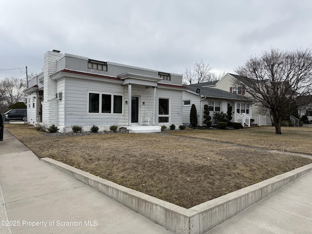 view of front of home featuring a chimney