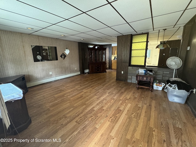 146 S Hyde Ave, Scranton, PA 18504 - living room featuring baseboard heating, wood finished floors, and a paneled ceiling