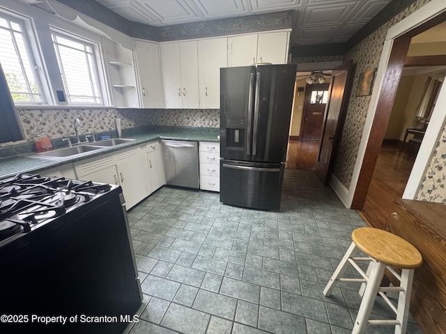 113 Claremont Ave, Clarks Summit, PA 18411 - kitchen with fridge with ice dispenser, stainless steel dishwasher, gas stove, wallpapered walls, and a sink
