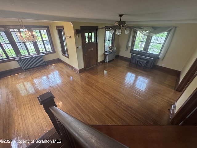 113 Claremont Ave, Clarks Summit, PA 18411 - living room with ceiling fan, wood finished floors, baseboards, and radiator