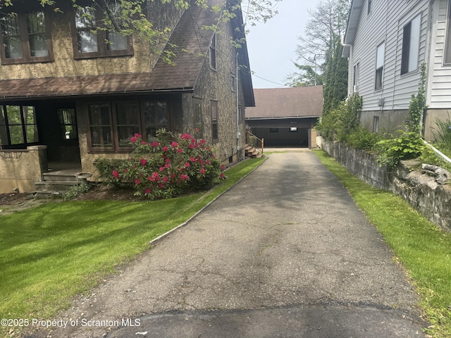 113 Claremont Ave, Clarks Summit, PA 18411 - view of home's exterior with a shingled roof and a lawn