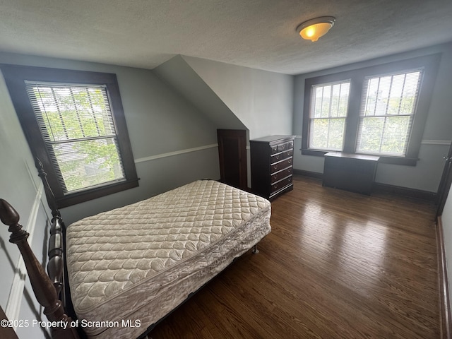 113 Claremont Ave, Clarks Summit, PA 18411 - bedroom with wood finished floors, a textured ceiling, and baseboards