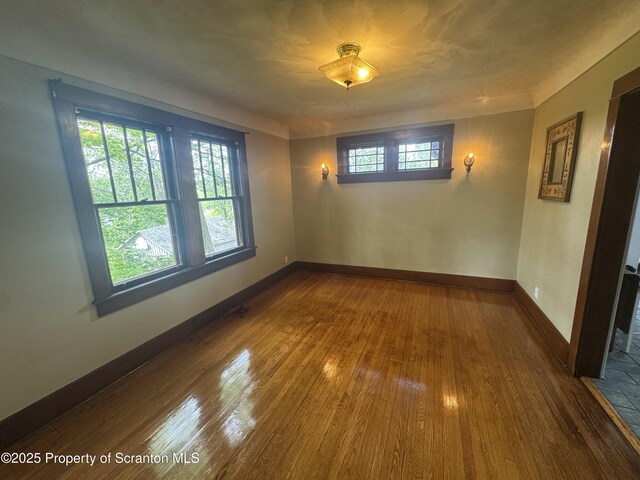 113 Claremont Ave, Clarks Summit, PA 18411 - unfurnished room with dark wood-style flooring and baseboards