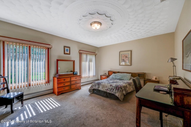 carpeted bedroom with a baseboard heating unit