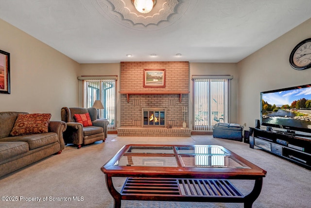carpeted living room featuring a fireplace