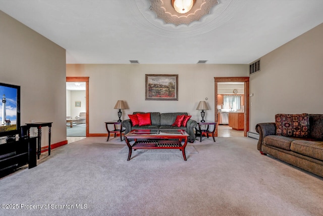 carpeted living room featuring visible vents, a baseboard radiator, and baseboards