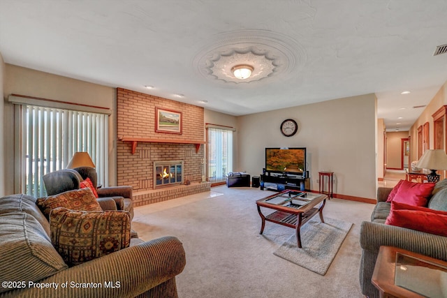 living room with a brick fireplace, baseboards, and light colored carpet