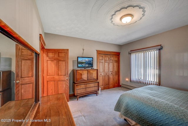 bedroom with light carpet and a closet