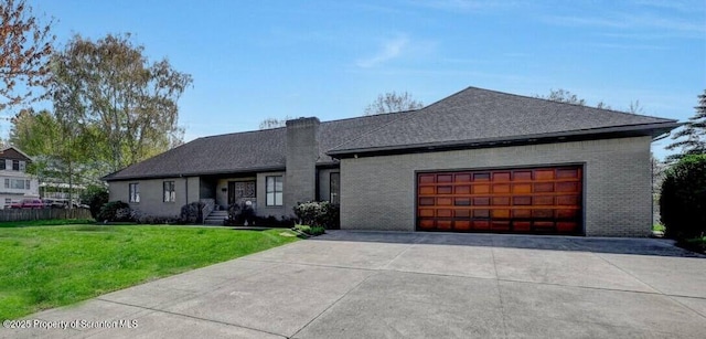 view of front of home with brick siding, an attached garage, a chimney, and a front yard