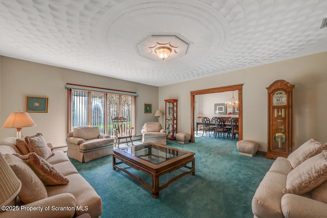 carpeted living room with visible vents and a notable chandelier