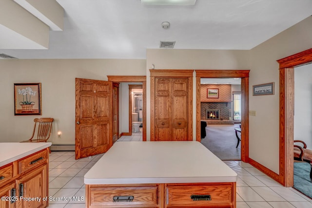 kitchen with light countertops, light tile patterned flooring, and visible vents