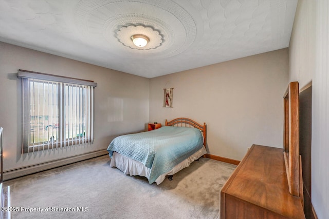 bedroom featuring baseboards, a baseboard radiator, and carpet