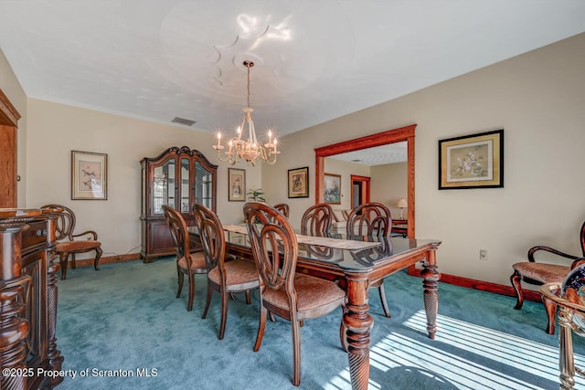 dining space featuring baseboards, visible vents, carpet, and a notable chandelier