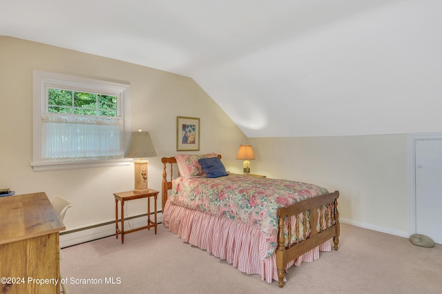 bedroom with carpet, lofted ceiling, and a baseboard heating unit