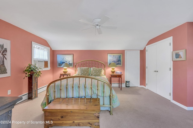 carpeted bedroom with ceiling fan and vaulted ceiling