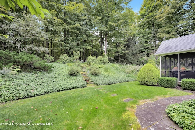 view of yard with a sunroom