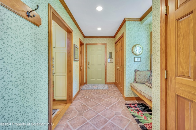 interior space featuring ornamental molding and light tile patterned flooring