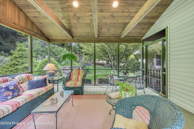 sunroom with lofted ceiling with beams