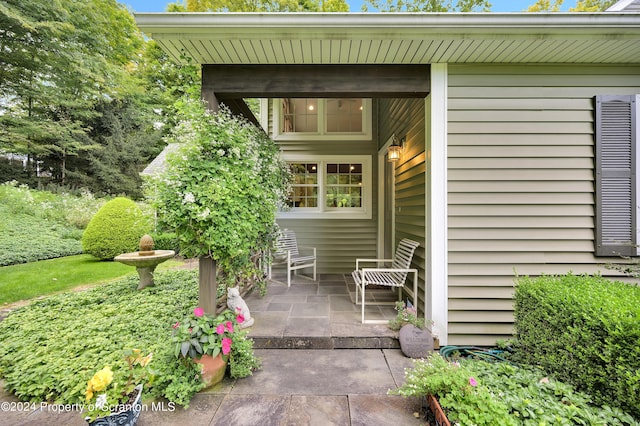 doorway to property with a patio area